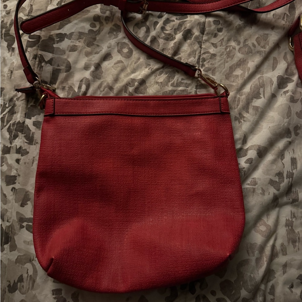 Red Crossbody Bag with Adjustable Strap and Gold Hardware